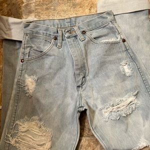 Vintage light wash distressed wranglers